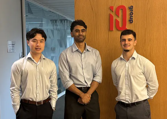 IQ Group graduate program cohort group photo demonstrating collaborative culture in financial services consulting